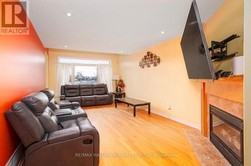 213 Duntroon Circle N, Ottawa, ON - Indoor Photo Showing Living Room With Fireplace