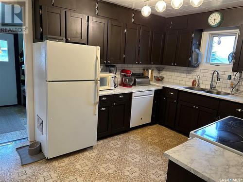 208 Margaret Street, Bulyea, SK - Indoor Photo Showing Kitchen With Double Sink