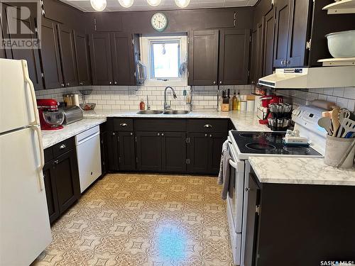 208 Margaret Street, Bulyea, SK - Indoor Photo Showing Kitchen With Double Sink