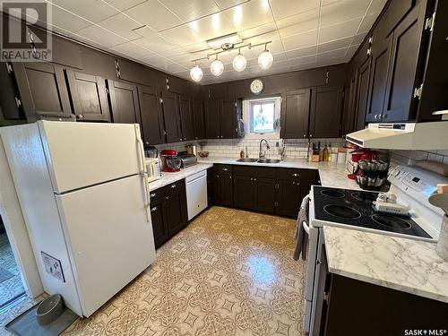 208 Margaret Street, Bulyea, SK - Indoor Photo Showing Kitchen With Double Sink