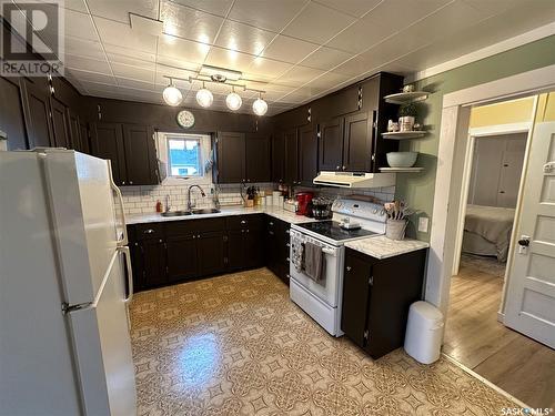 208 Margaret Street, Bulyea, SK - Indoor Photo Showing Kitchen With Double Sink