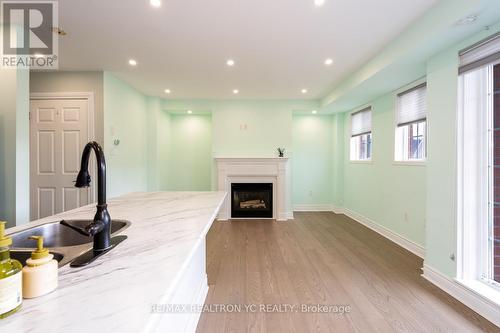 B202 - 98 Cornell Park Avenue, Markham, ON - Indoor With Fireplace