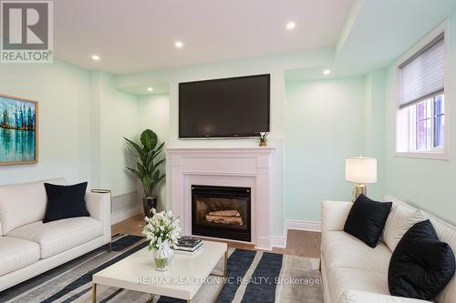 B202 - 98 Cornell Park Avenue, Markham, ON - Indoor Photo Showing Living Room With Fireplace