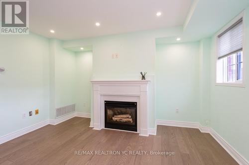 B202 - 98 Cornell Park Avenue, Markham, ON - Indoor With Fireplace