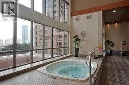 909 - 4090 Living Arts Drive, Mississauga, ON - Indoor Photo Showing Other Room With In Ground Pool