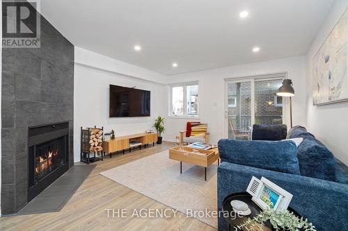 4D Shank Street, Toronto, ON - Indoor Photo Showing Living Room With Fireplace