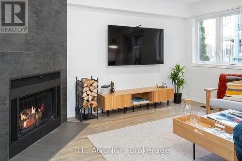 4D Shank Street, Toronto, ON - Indoor Photo Showing Living Room With Fireplace