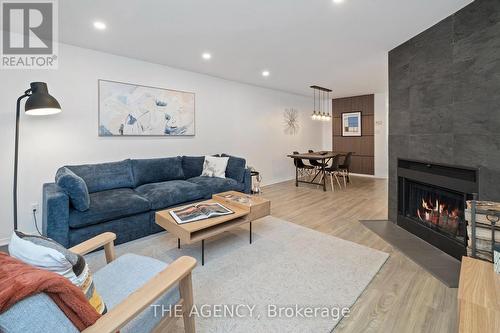 4D Shank Street, Toronto, ON - Indoor Photo Showing Living Room With Fireplace