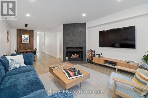 4D Shank Street, Toronto, ON - Indoor Photo Showing Living Room With Fireplace