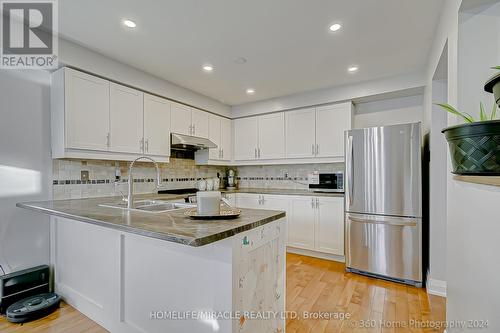 76 Kate Aitken Crescent, New Tecumseth, ON - Indoor Photo Showing Kitchen With Stainless Steel Kitchen With Double Sink