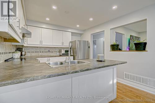 76 Kate Aitken Crescent, New Tecumseth, ON - Indoor Photo Showing Kitchen With Double Sink