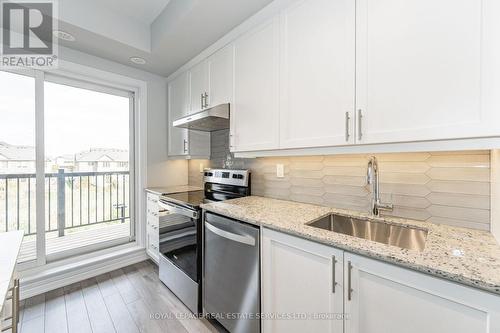 305 - 349 Wheat Boom Drive, Oakville, ON - Indoor Photo Showing Kitchen With Upgraded Kitchen