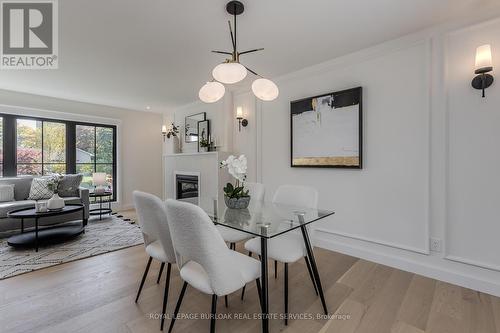 3029 Eva Drive, Burlington, ON - Indoor Photo Showing Dining Room With Fireplace