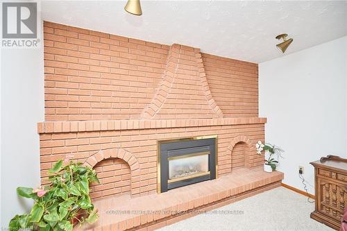 27 Quinn Avenue, Hamilton (Quinndale), ON - Indoor Photo Showing Living Room With Fireplace