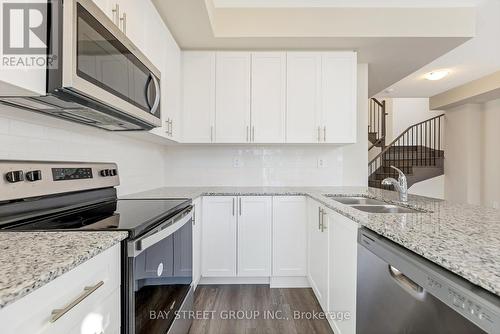 111 - 1573 Rose Way, Milton, ON - Indoor Photo Showing Kitchen With Double Sink With Upgraded Kitchen