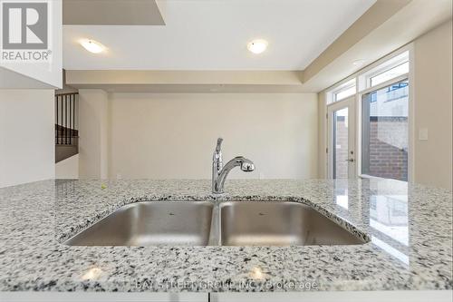 111 - 1573 Rose Way, Milton, ON - Indoor Photo Showing Kitchen With Double Sink With Upgraded Kitchen