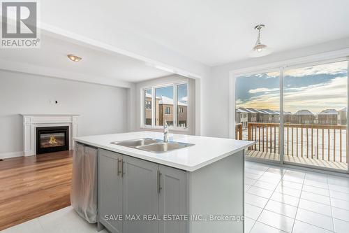 856 Knights Lane, Woodstock, ON - Indoor Photo Showing Kitchen With Fireplace With Double Sink