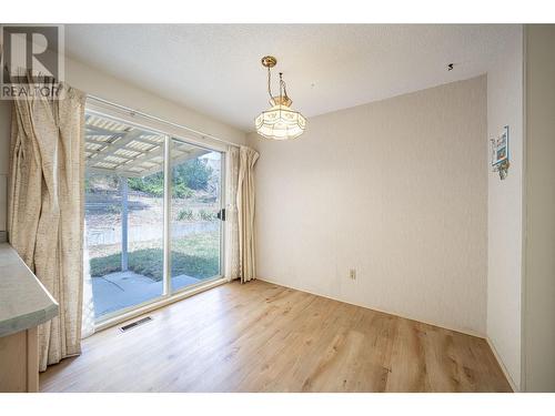 eat-in kitchen area with sliding doors to back patio. - 6477 Southwind Road, Vernon, BC - Indoor Photo Showing Other Room