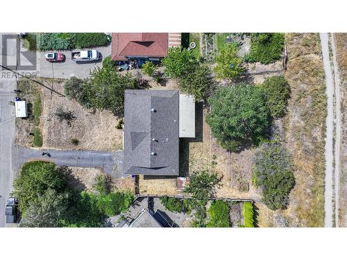 New Roof 2024 aerial view of home with grey canal trail in back - 6477 Southwind Road, Vernon, BC - Outdoor