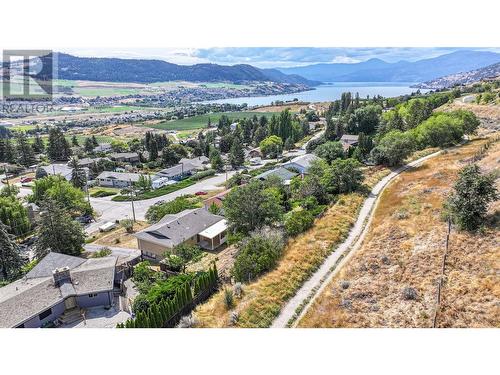 grey canal trail running behind the backyard - 6477 Southwind Road, Vernon, BC - Outdoor With Body Of Water With View