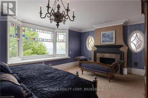 22 Bayview Drive, St. Catharines (438 - Port Dalhousie), ON - Indoor Photo Showing Bedroom With Fireplace