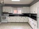 304 4Th Street W, Wynyard, SK  - Indoor Photo Showing Kitchen With Double Sink 