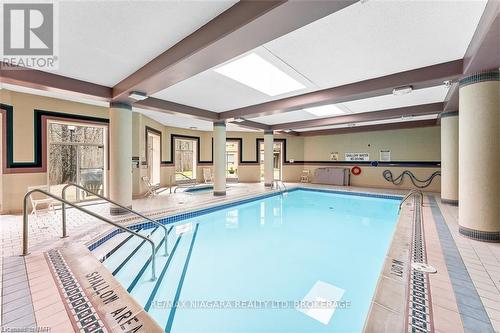 523 - 8111 Forest Glen Drive, Niagara Falls (208 - Mt. Carmel), ON - Indoor Photo Showing Other Room With In Ground Pool