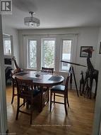 Dining space featuring wood-type flooring - 