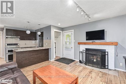 113 - 23 Dawson Drive, Collingwood, ON - Indoor Photo Showing Living Room With Fireplace