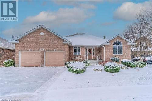 View of front of home with a garage - 64 Cottonwood Crescent, Cambridge, ON - Outdoor With Facade