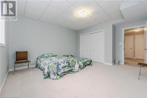 Carpeted bedroom with a drop ceiling and a closet - 64 Cottonwood Crescent, Cambridge, ON - Indoor Photo Showing Bedroom