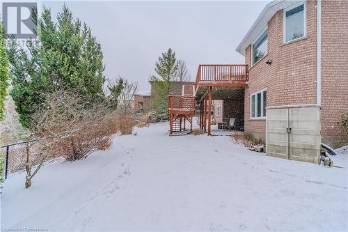 Yard layered in snow with a shed and a deck - 64 Cottonwood Crescent, Cambridge, ON - Outdoor With Exterior