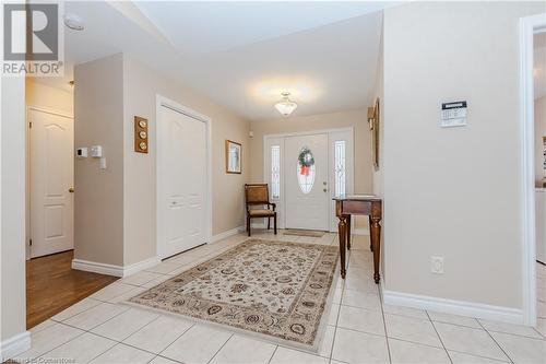 Entrance foyer featuring light tile patterned floors - 64 Cottonwood Crescent, Cambridge, ON - Indoor Photo Showing Other Room