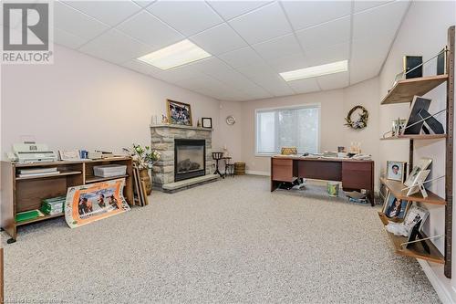 Could also be used as a 4th bedroom. featuring gas fireplace - 64 Cottonwood Crescent, Cambridge, ON - Indoor With Fireplace