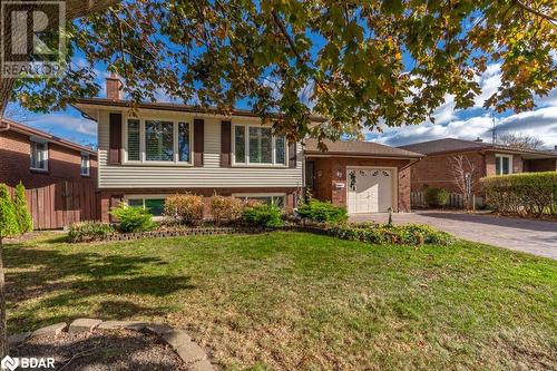 Split level home with a front yard and a garage - 47 Westfield Drive, St. Catharines, ON - Outdoor