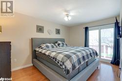 Bedroom featuring ceiling fan and light hardwood / wood-style flooring - 