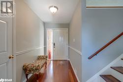 Foyer with hardwood / wood-style flooring - 