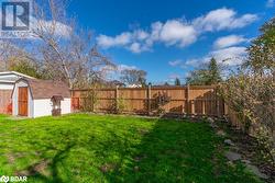 View of yard featuring a storage unit - 