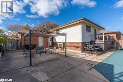 Back of house featuring a gazebo, a patio area, and a covered pool - 