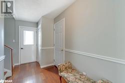 Living area featuring hardwood / wood-style flooring and a textured ceiling - 