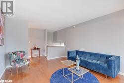 Sitting room featuring wood-type flooring - 