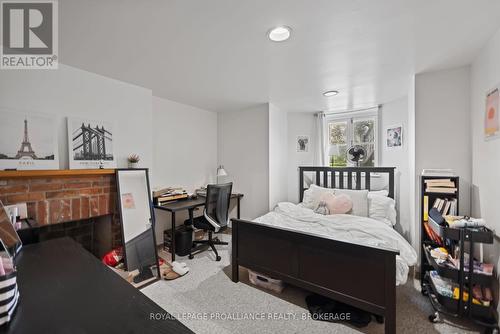 59 West Street W, Kingston (Central City East), ON - Indoor Photo Showing Bedroom With Fireplace