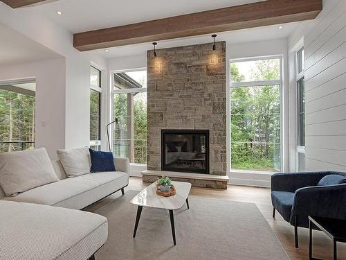 Living room - 1504 Ch. De L'Armoise, Piedmont, QC - Indoor Photo Showing Living Room With Fireplace