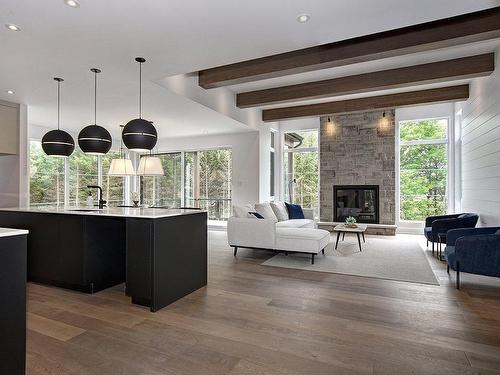 Vue d'ensemble - 1504 Ch. De L'Armoise, Piedmont, QC - Indoor Photo Showing Living Room With Fireplace