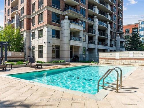 208-2391 Central Park Dr, Oakville, ON - Outdoor With In Ground Pool