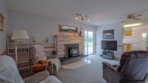 5831 Old Vernon Road, Kelowna, BC - Indoor Photo Showing Living Room With Fireplace