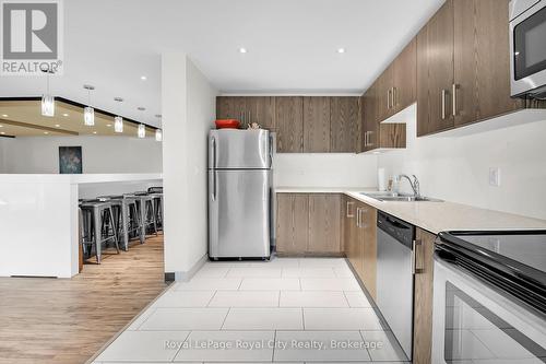 408 - 106 Bard Boulevard, Guelph (Pine Ridge), ON - Indoor Photo Showing Kitchen With Stainless Steel Kitchen With Double Sink