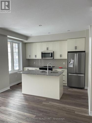 121 - 10 Birmingham Drive, Cambridge, ON - Indoor Photo Showing Kitchen With Stainless Steel Kitchen With Double Sink