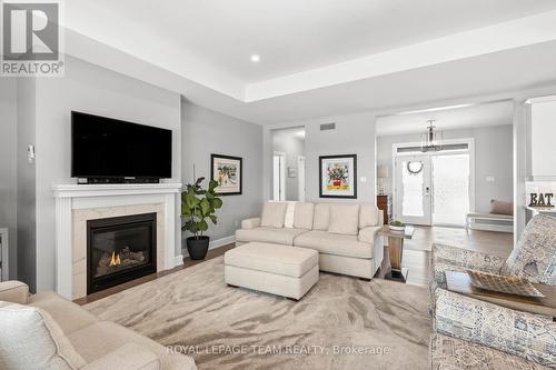 7080 Still Meadow Way, Ottawa, ON - Indoor Photo Showing Living Room With Fireplace