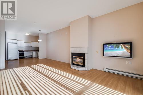 920 Saskatoon Road Unit# 119, Kelowna, BC - Indoor Photo Showing Other Room With Fireplace